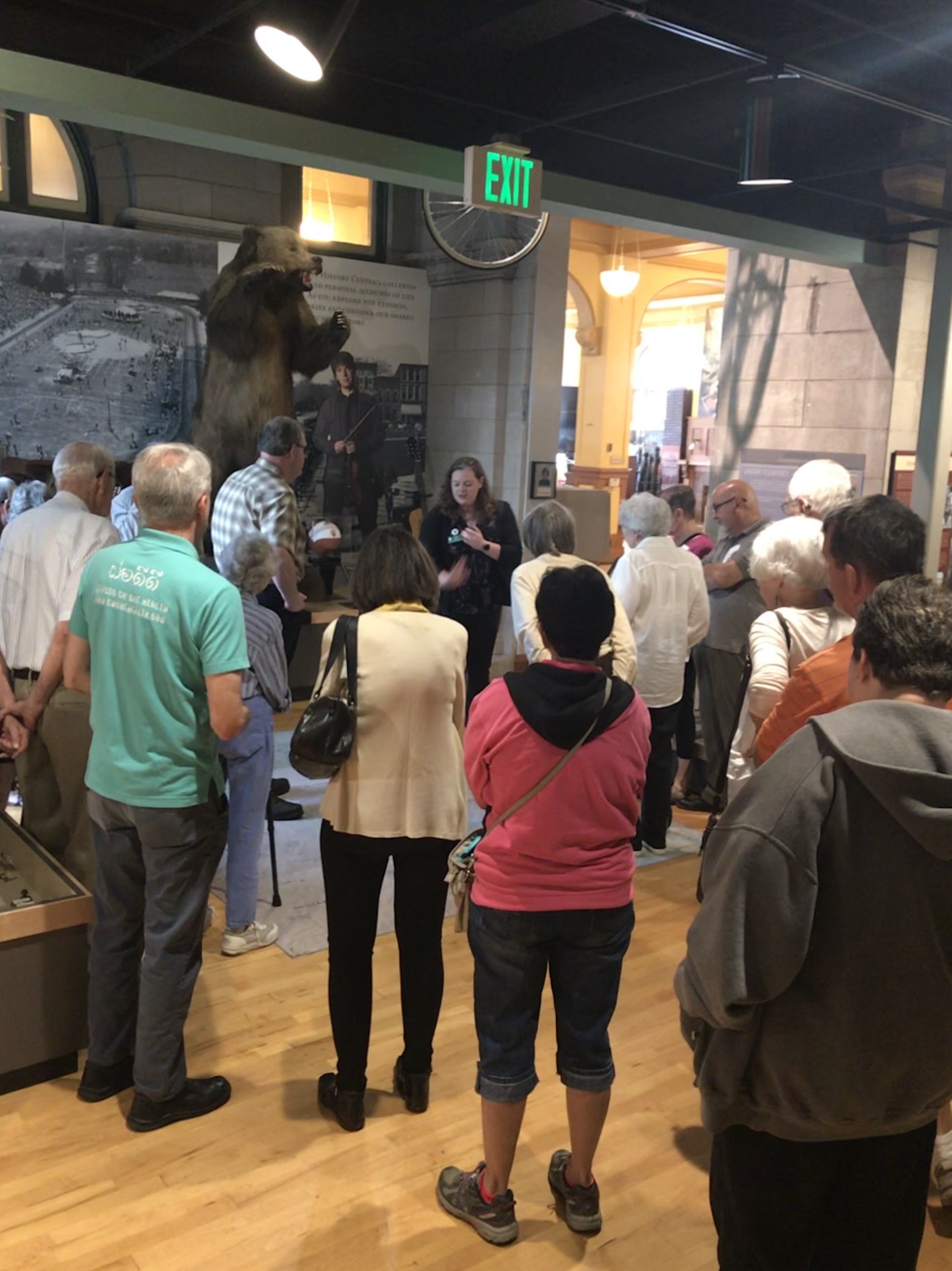 Figure 2: Andrea Hadsell (far center), Education Manager, leads a guided memory walk through the permanent exhibit galleries of the Monroe County History Center.